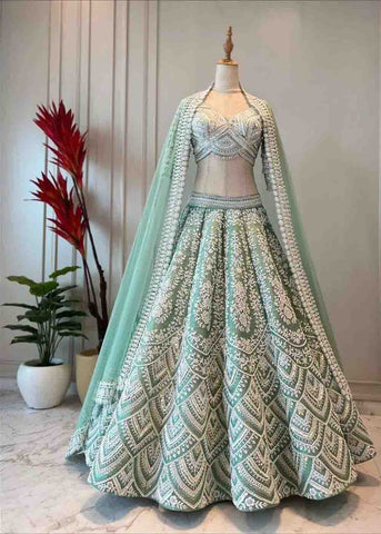 luxurious and iconic Mint green lehenga with ivory hand embroidery
